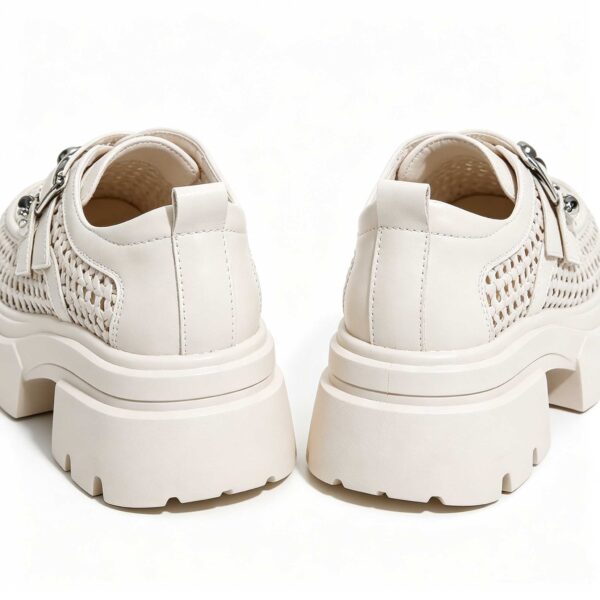 Back view of women's white thick sole platform shoes with chunky heel and breathable mesh upper