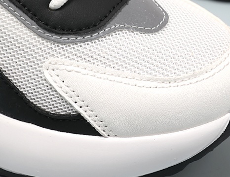 Roomy rounded toe cap mesh knit fabric closeup women hidden lift elevator height increasing shoe